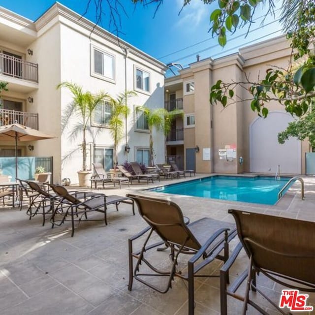 view of pool with a patio area