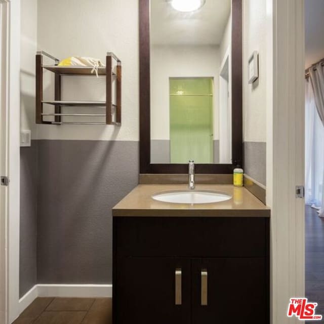 bathroom featuring tile patterned floors and vanity