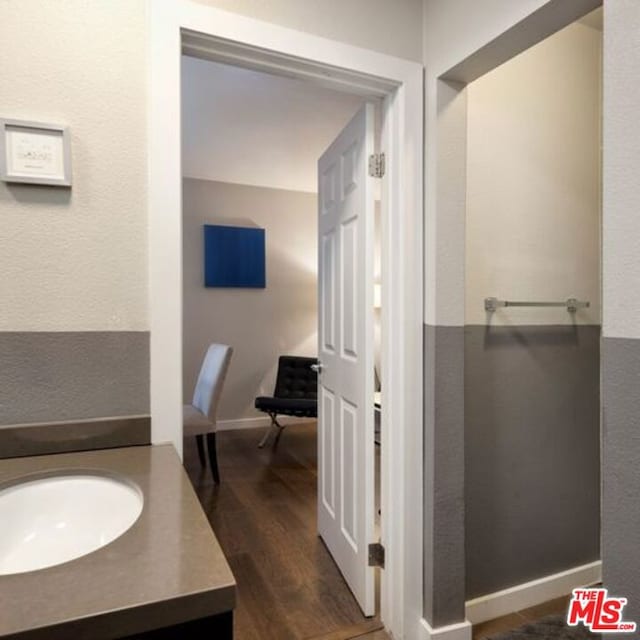 bathroom featuring vanity and hardwood / wood-style floors