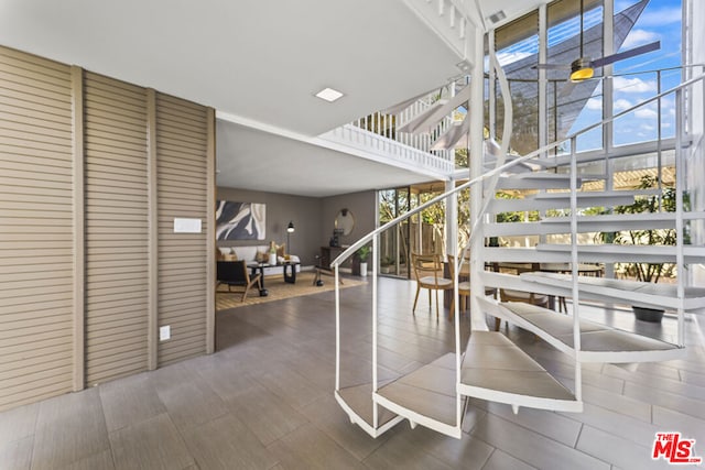 stairs featuring floor to ceiling windows