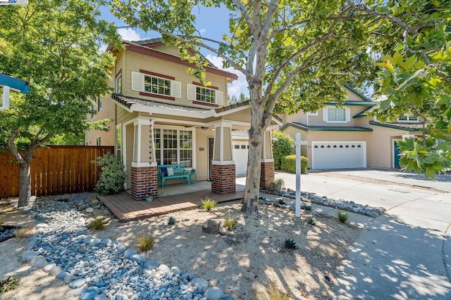 view of front of property featuring a garage and covered porch