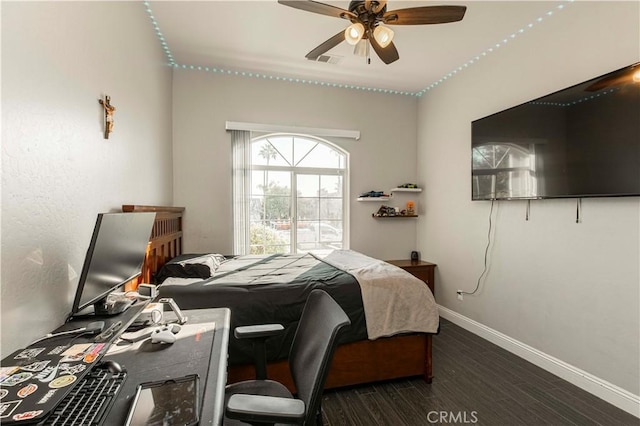 bedroom featuring ceiling fan and dark hardwood / wood-style flooring