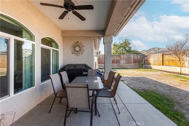 view of patio featuring ceiling fan