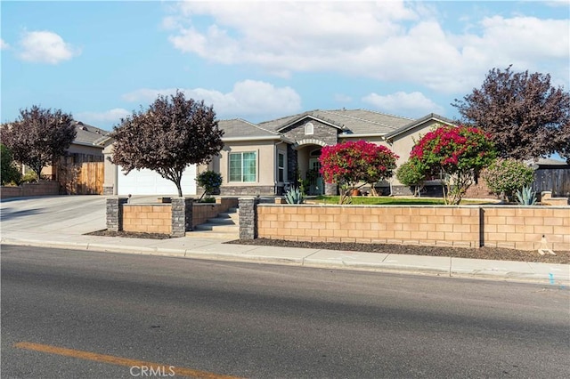 view of front of home with a garage