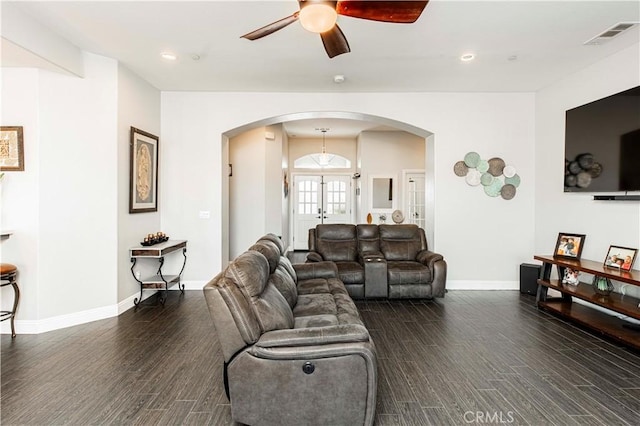 living room with ceiling fan, french doors, and dark hardwood / wood-style floors