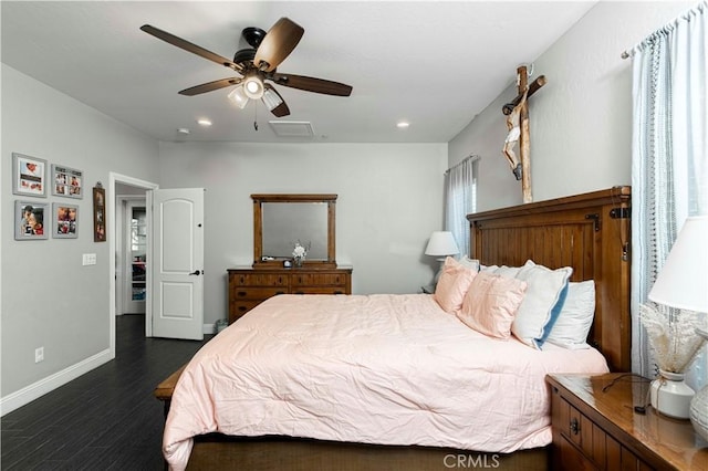 bedroom with ceiling fan and dark hardwood / wood-style flooring