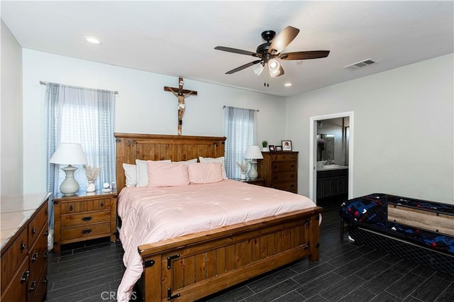 bedroom featuring ceiling fan and ensuite bath