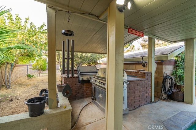 view of patio / terrace featuring area for grilling and exterior kitchen