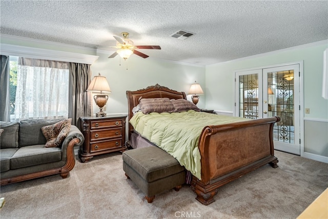 carpeted bedroom featuring ceiling fan, access to exterior, french doors, ornamental molding, and a textured ceiling