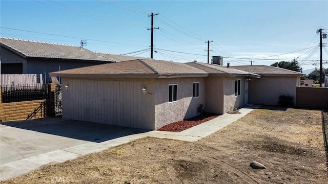 rear view of house with cooling unit