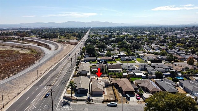 drone / aerial view featuring a mountain view