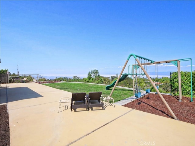 view of patio featuring a playground