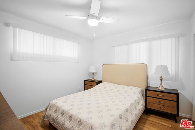 bedroom featuring hardwood / wood-style floors and ceiling fan