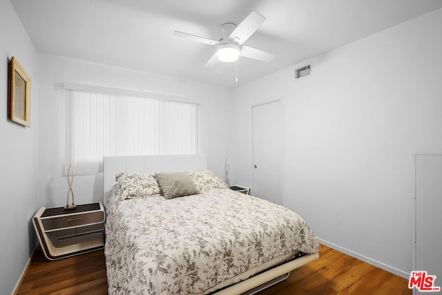 bedroom featuring dark hardwood / wood-style floors and ceiling fan