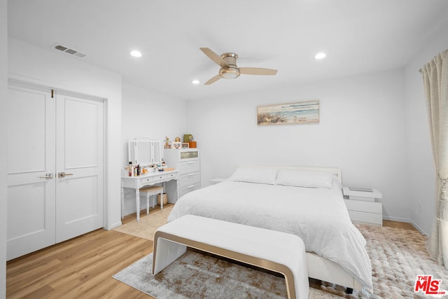 bedroom with ceiling fan and light wood-type flooring