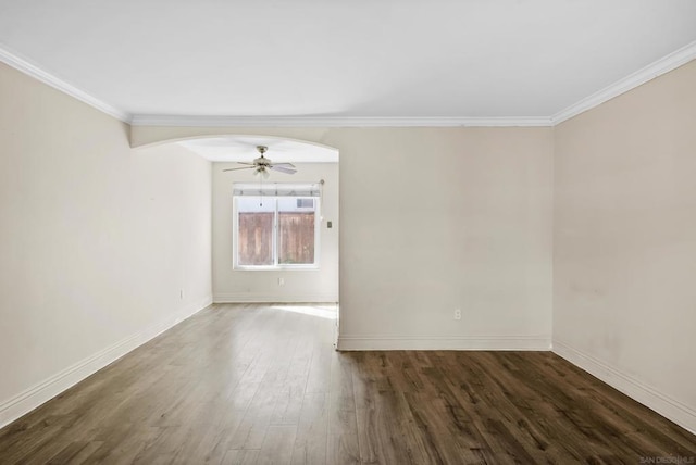 unfurnished room with ornamental molding, dark hardwood / wood-style floors, and ceiling fan