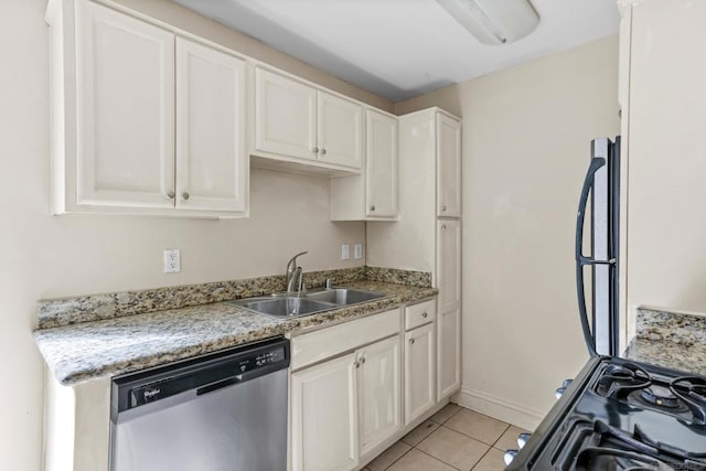 kitchen with white cabinetry, dishwasher, sink, light tile patterned floors, and light stone counters