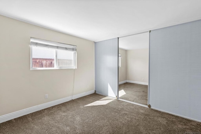 unfurnished bedroom featuring a closet and carpet