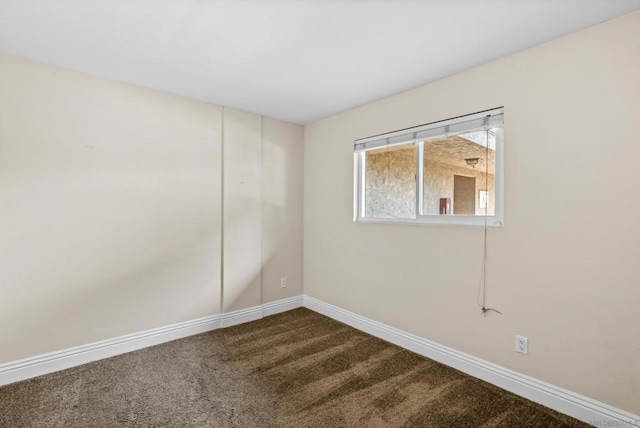 spare room featuring carpet floors