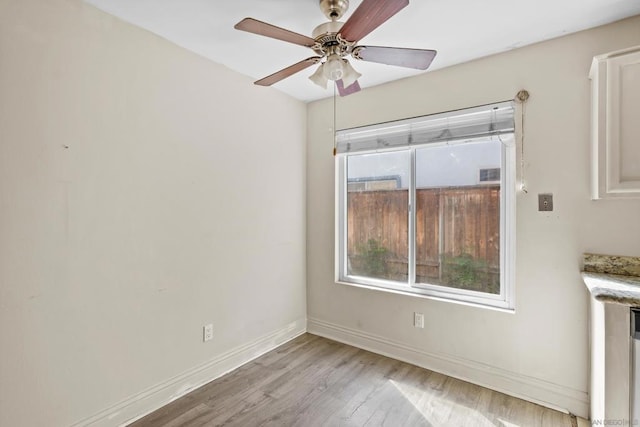 spare room with ceiling fan and light hardwood / wood-style floors