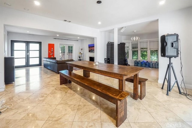 dining area featuring a wealth of natural light and french doors