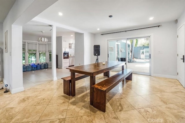 dining room with light tile patterned flooring and a wealth of natural light