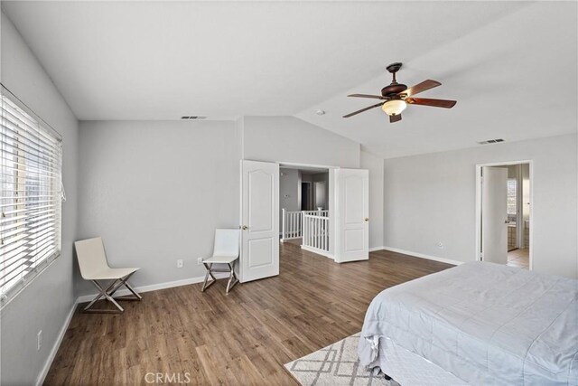 bedroom featuring hardwood / wood-style flooring, ceiling fan, and lofted ceiling