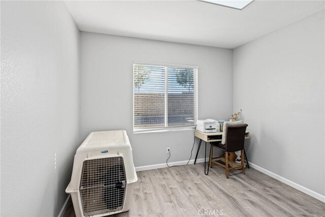 home office with light wood-type flooring