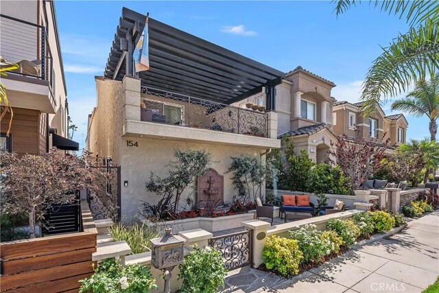 rear view of house with a balcony