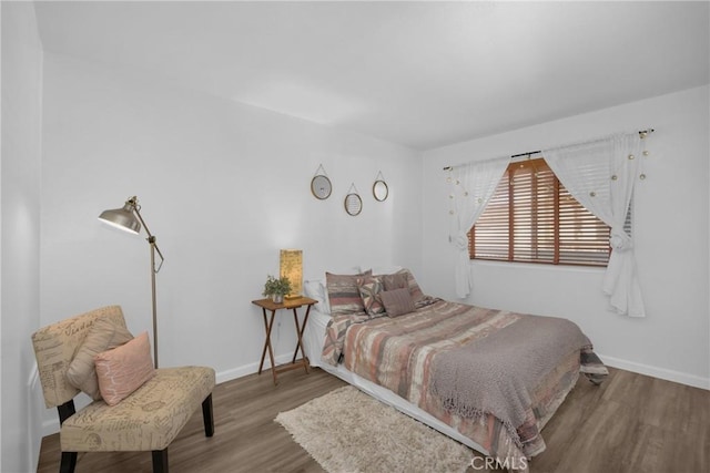 bedroom with hardwood / wood-style floors