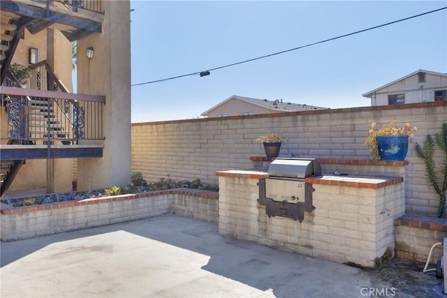 view of patio / terrace with exterior kitchen and grilling area