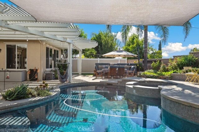 view of swimming pool featuring a pergola, an in ground hot tub, and a patio