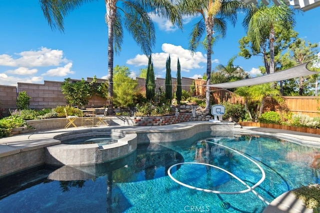 view of pool with an in ground hot tub