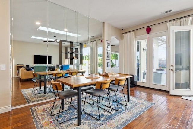 dining room featuring wood-type flooring and french doors