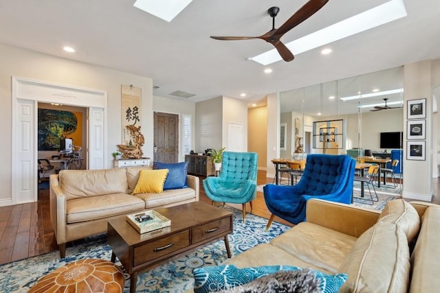 living room featuring hardwood / wood-style flooring and ceiling fan