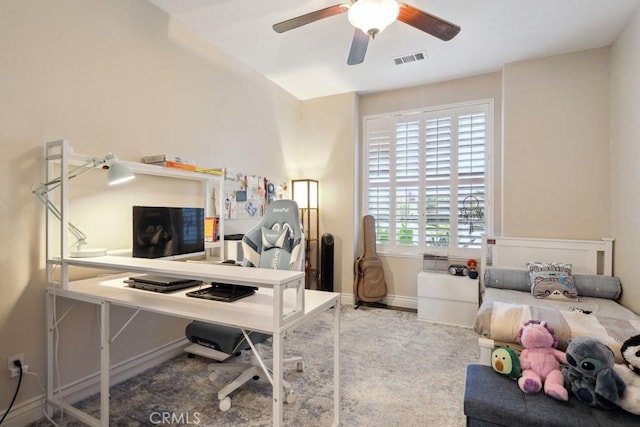 carpeted office with ceiling fan