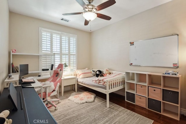 bedroom featuring ceiling fan and dark hardwood / wood-style floors