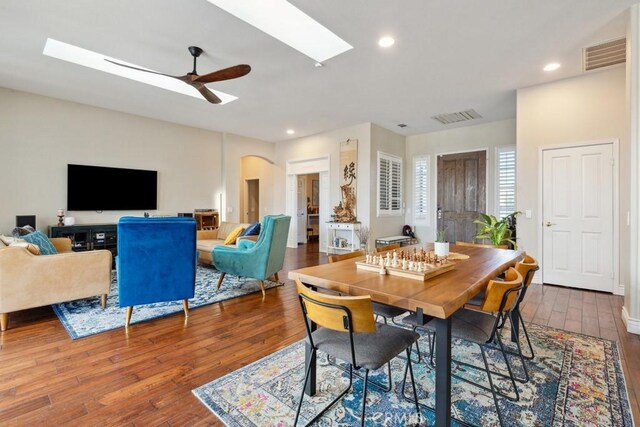 dining room with hardwood / wood-style floors and ceiling fan