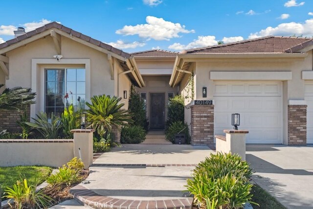 view of front of property with a garage