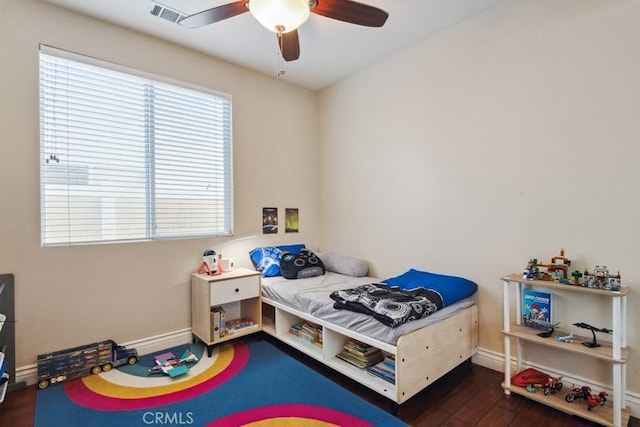 bedroom featuring dark hardwood / wood-style flooring and ceiling fan