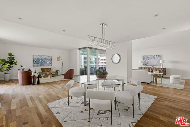 dining space featuring light wood-type flooring