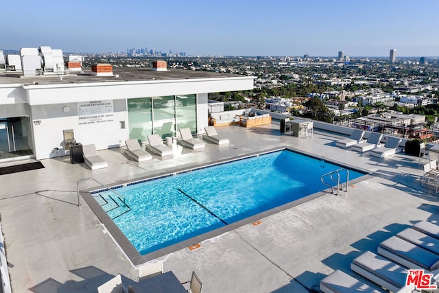 view of swimming pool with a patio area