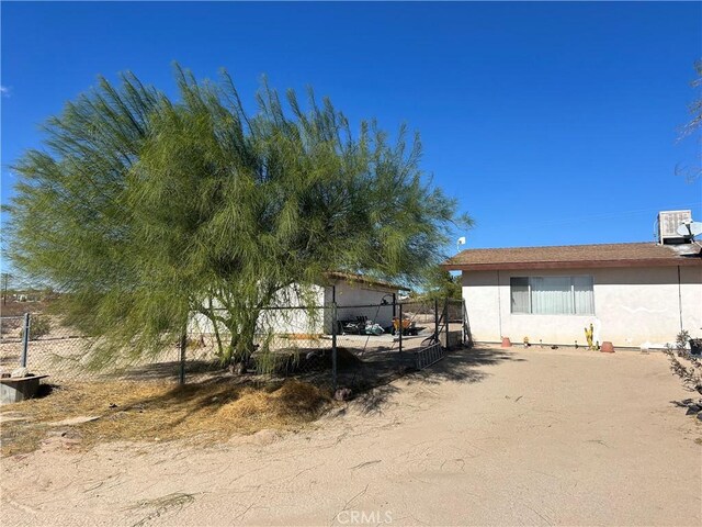 view of property exterior with central AC