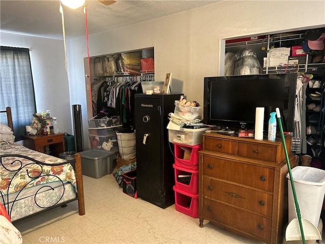 63737 Gibson Rd, Joshua Tree, CA 92252 - bedroom featuring a closet, tile patterned floors, and a textured ceiling