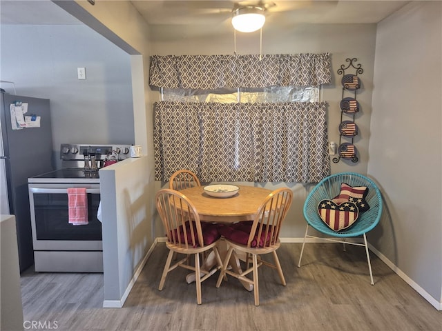 63737 Gibson Rd, Joshua Tree, CA 92252 - dining space featuring wood finished floors and ceiling fan