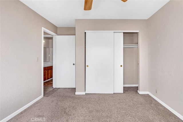 unfurnished bedroom featuring a ceiling fan, carpet, baseboards, and a closet