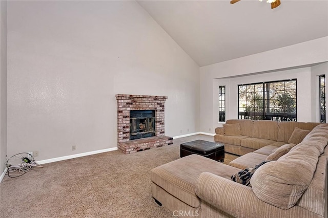 carpeted living room featuring baseboards, a fireplace, high vaulted ceiling, and a ceiling fan