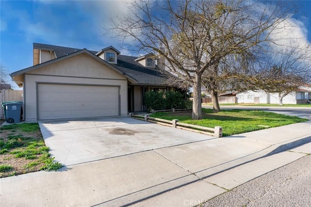 view of front of house with a garage, concrete driveway, and a front yard