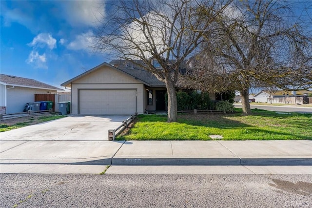 view of front of house with a front yard, driveway, and an attached garage