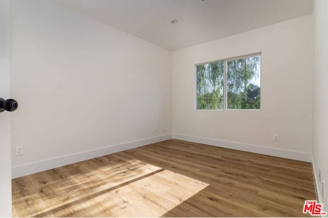 empty room featuring hardwood / wood-style floors